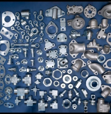 Realistic 3D model of a proposed industrial warehouse with landscaped surroundings and loading bay area