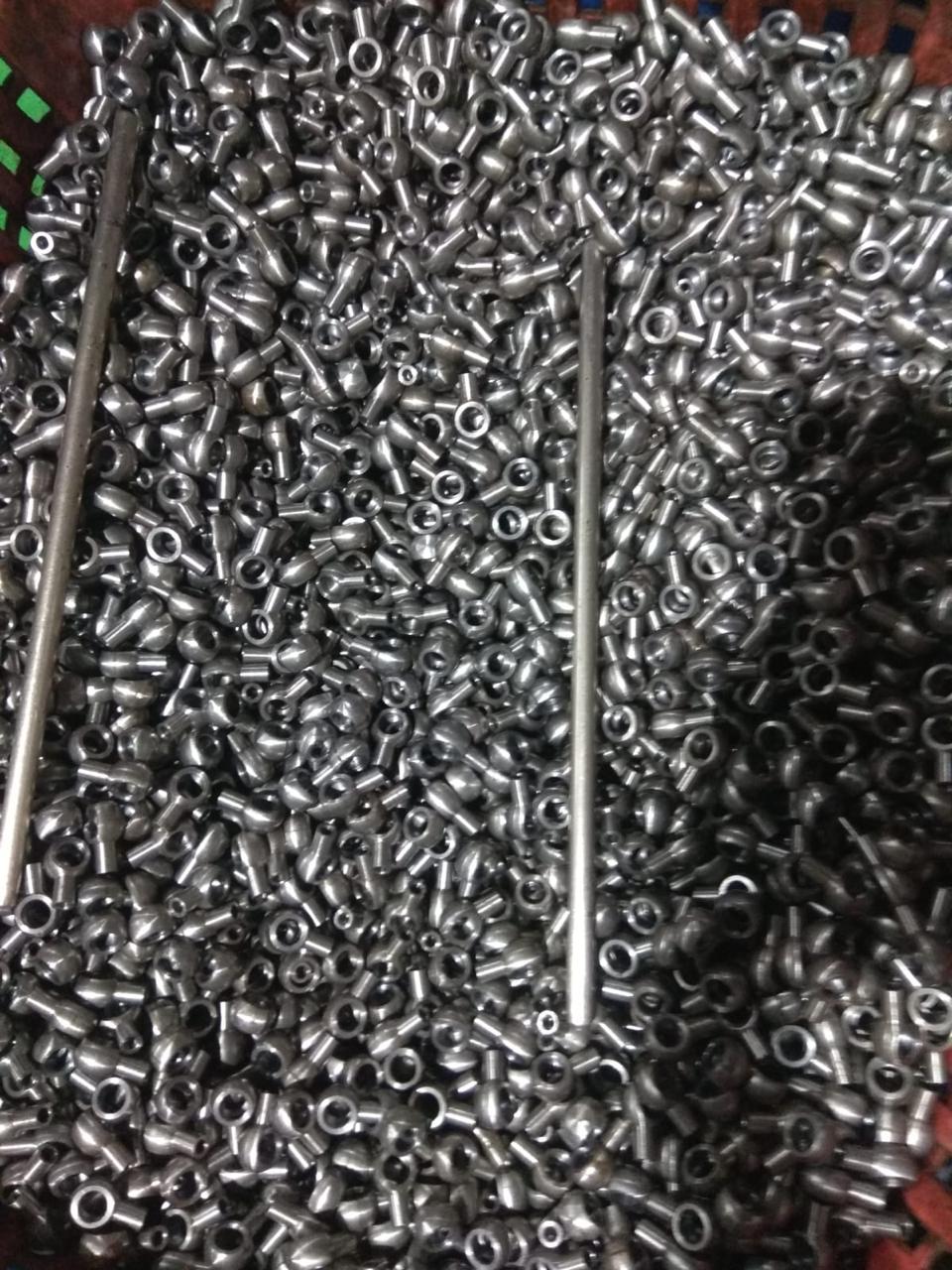 Close-up of a bulk collection of precision-engineered metal components for industrial manufacturing